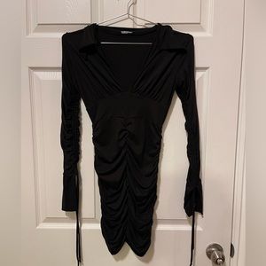 Black dress very form fitting to the body